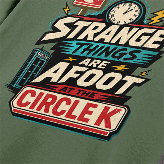 Close-up of ‘strange things are afoot at the circle k’ quote T-shirt in military green from Bill & Ted’s Excellent Adventure