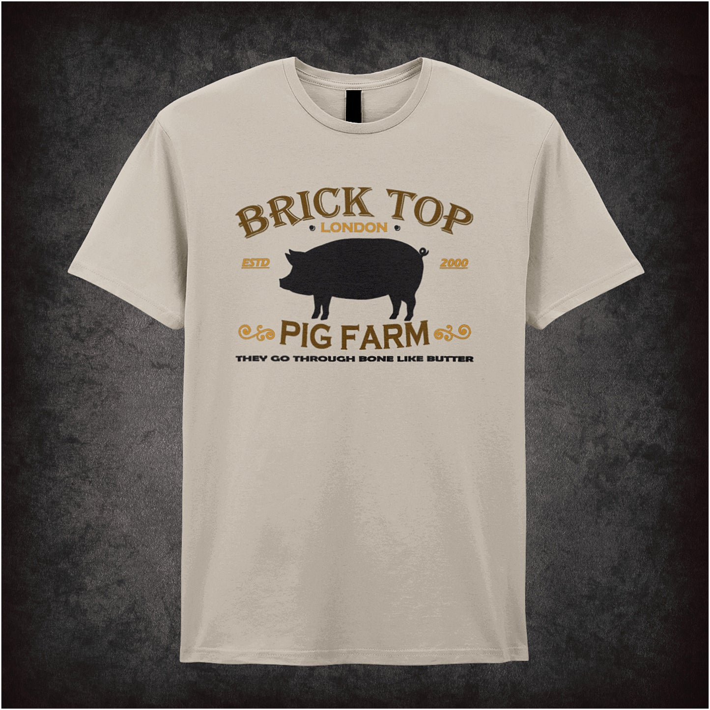 Natural coloured unisex t-shirt featuring the text “Brick Top Pig Farm” styled with a gritty design inspired by the movie Snatch.