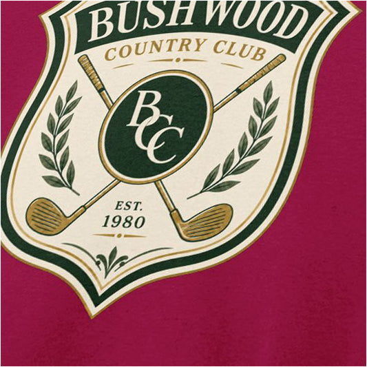 Close-up of ‘bushwood country club badge’ T-shirt in cardinal red from Caddyshack