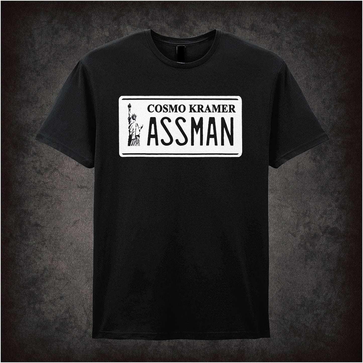 black unisex T-shirt featuring “Cosmo Kramer Assman” phrase inspired by Seinfeld, displayed in bold, playful typography.
