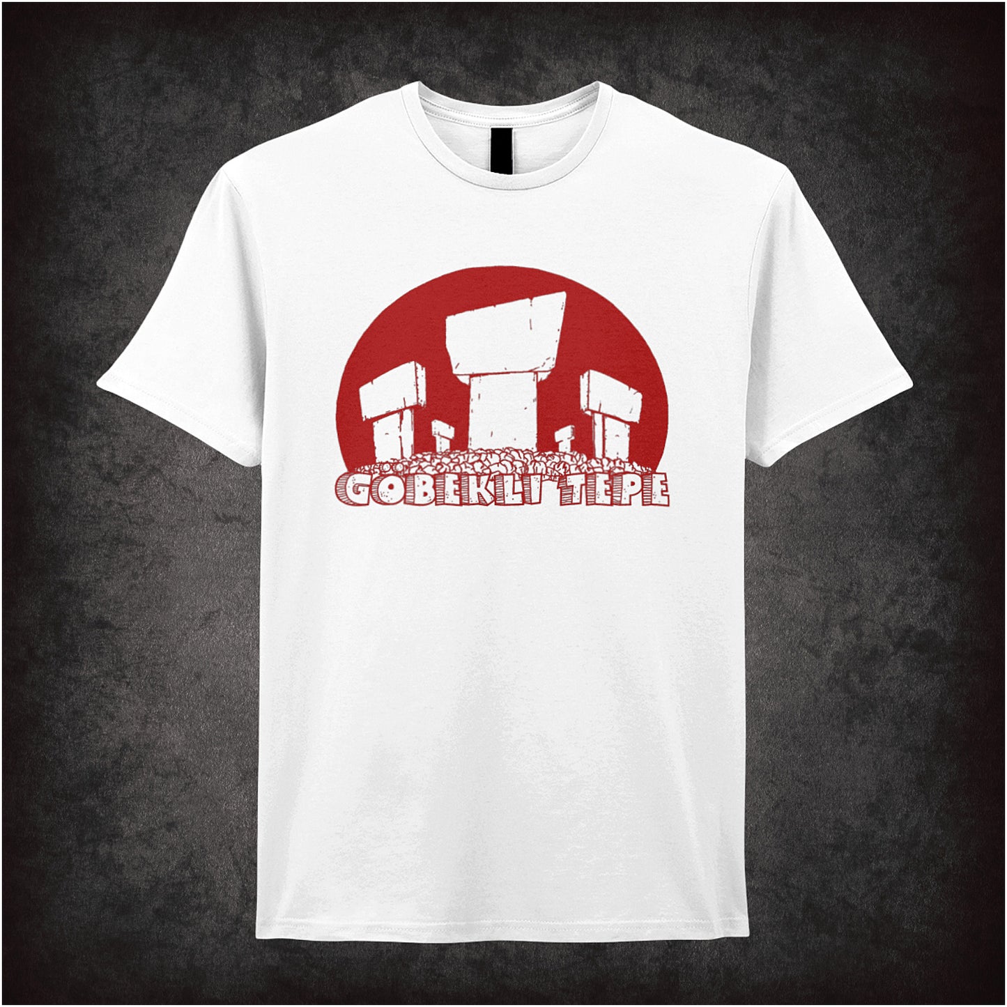 white unisex t-shirt featuring a graphic of Gobekli Tepe, the ancient Turkish archaeological site, showing stylized stone pillars with carved animal figures and geometric patterns.