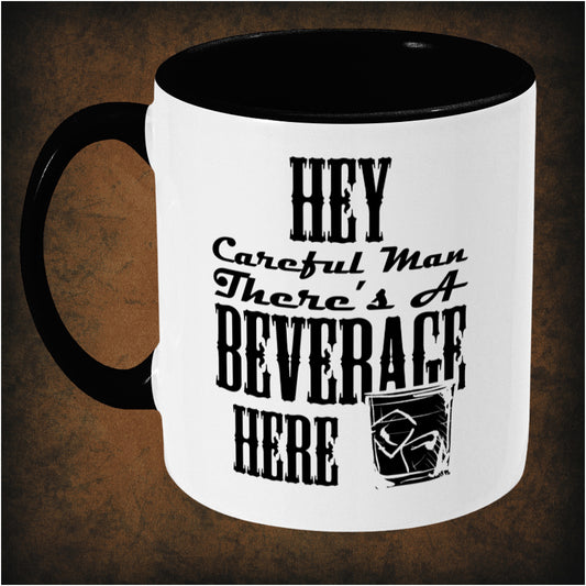 Hey, careful man, there’s a beverage here’ two-toned mug inspired by The Big Lebowski, left hand side featuring iconic movie quote, minimalist design, and pop culture collectible style.