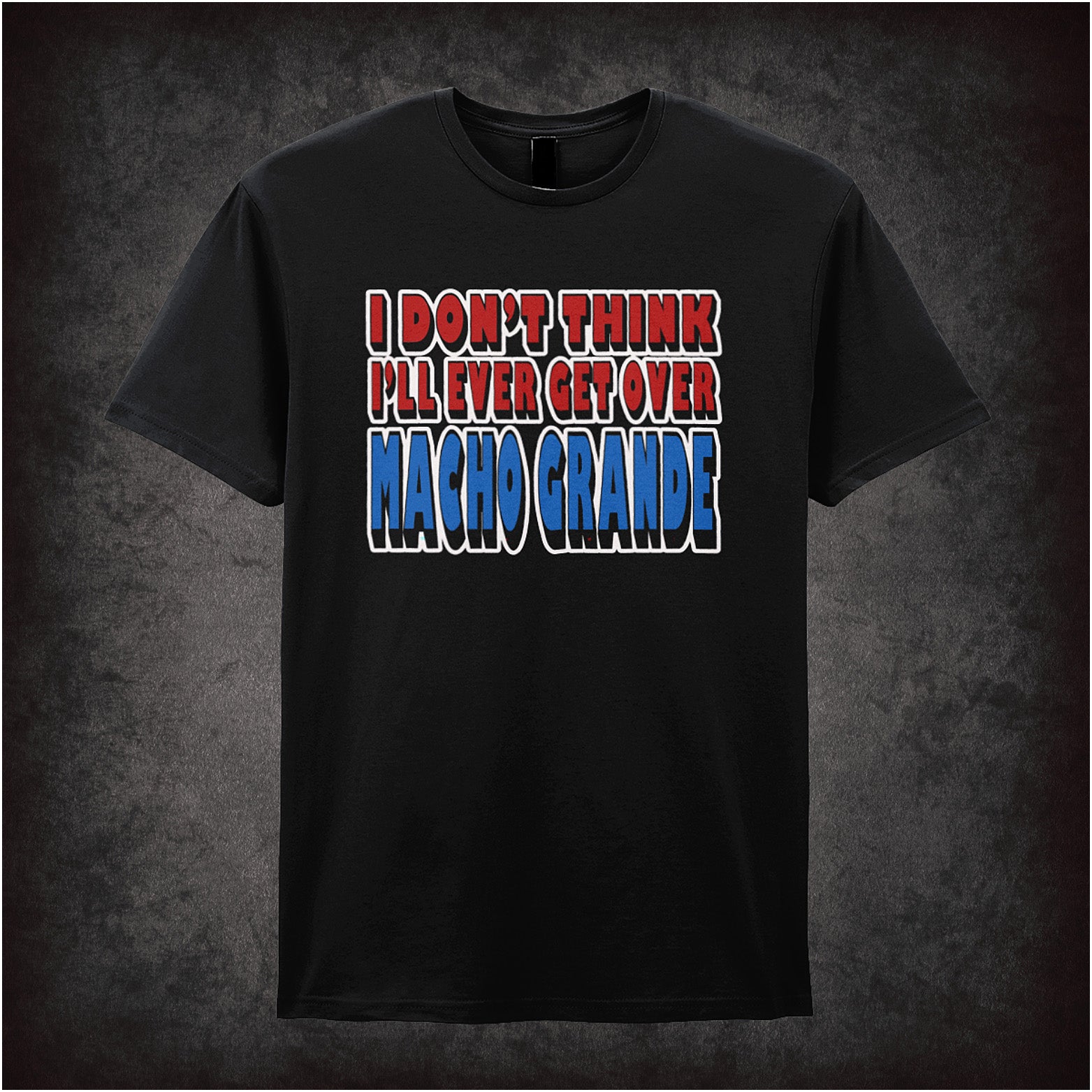 black unisex T-shirt featuring the quote “I Don't Think I'll Ever Get Over Macho Grande” inspired by Airplane!, displayed in bold, vintage-style typography.