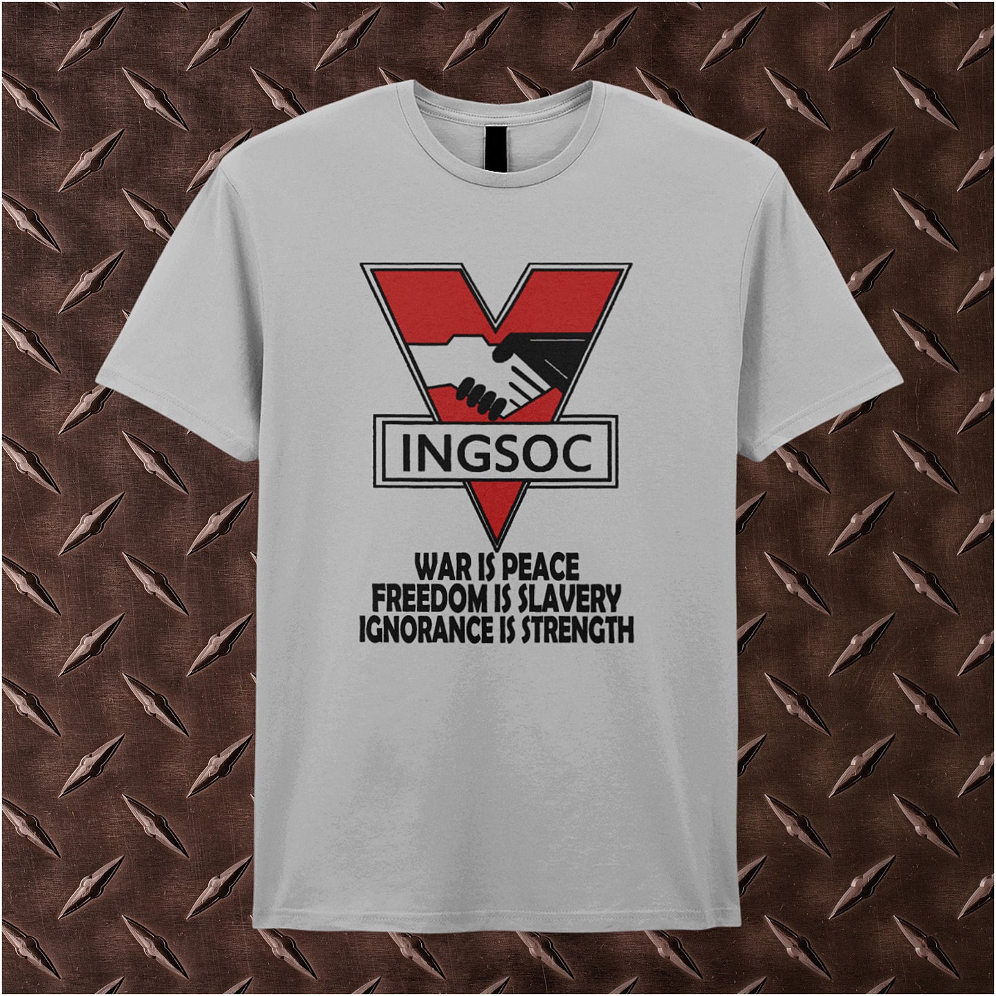 sand unisex t-shirt featuring bold black text displaying “INGSOC” and the slogan “War Is Peace Freedom Is Slavery Ignorance Is Strength” from George Orwell’s 1984, styled in a stark, minimalist design.