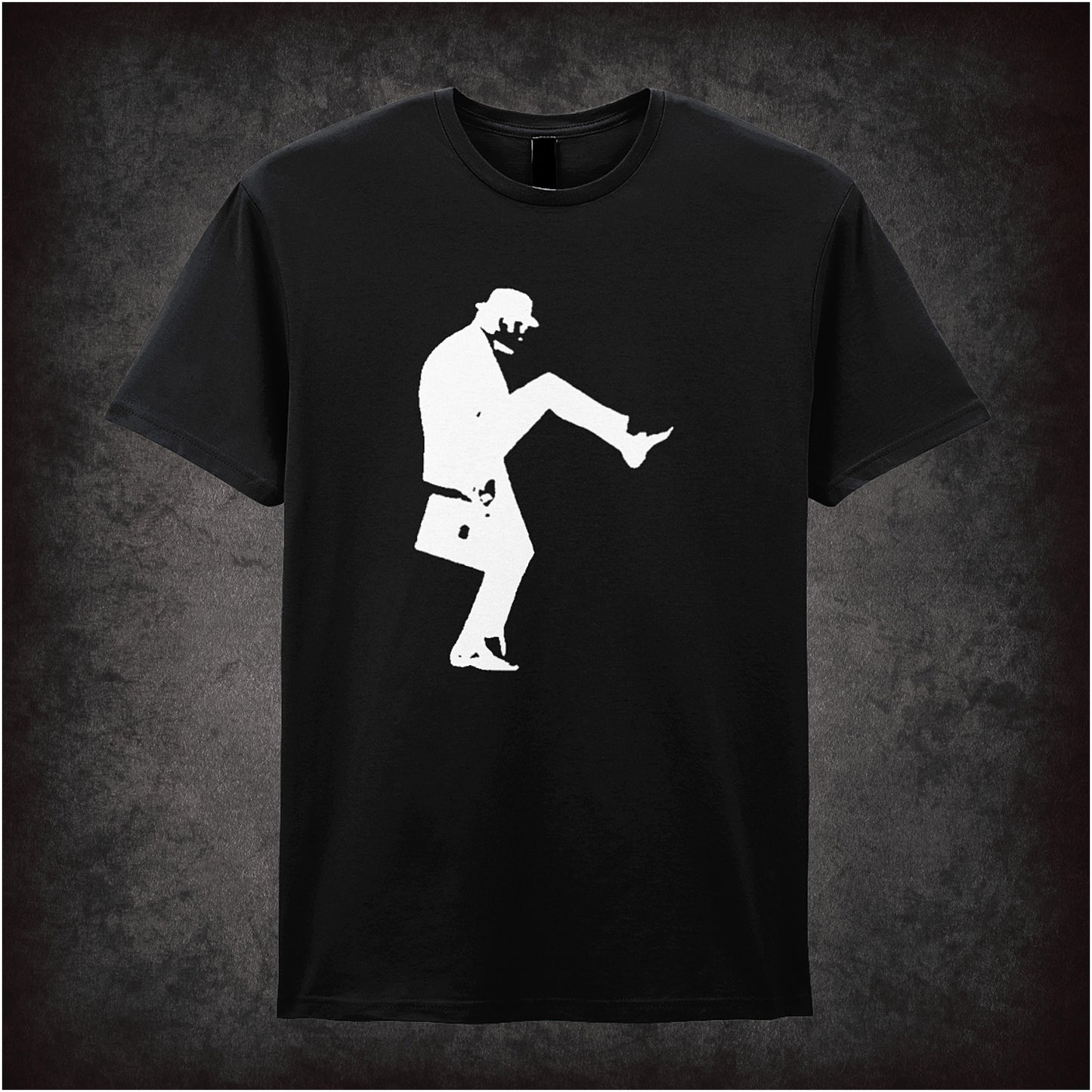Black unisex t-shirt featuring a silhouette graphic of John Cleese doing his famous Silly Walk, wearing a bowler hat and carrying a briefcase, inspired by Monty Python.