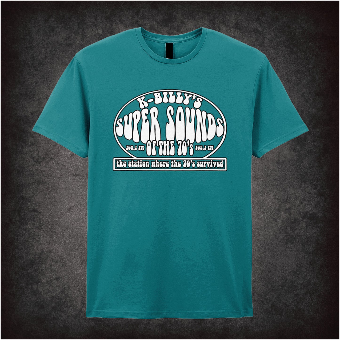 antique sapphire unisex T-shirt featuring “K-Billy's Super Sounds Of The '70s” design inspired by Reservoir Dogs, displayed in bold retro-style white lettering.