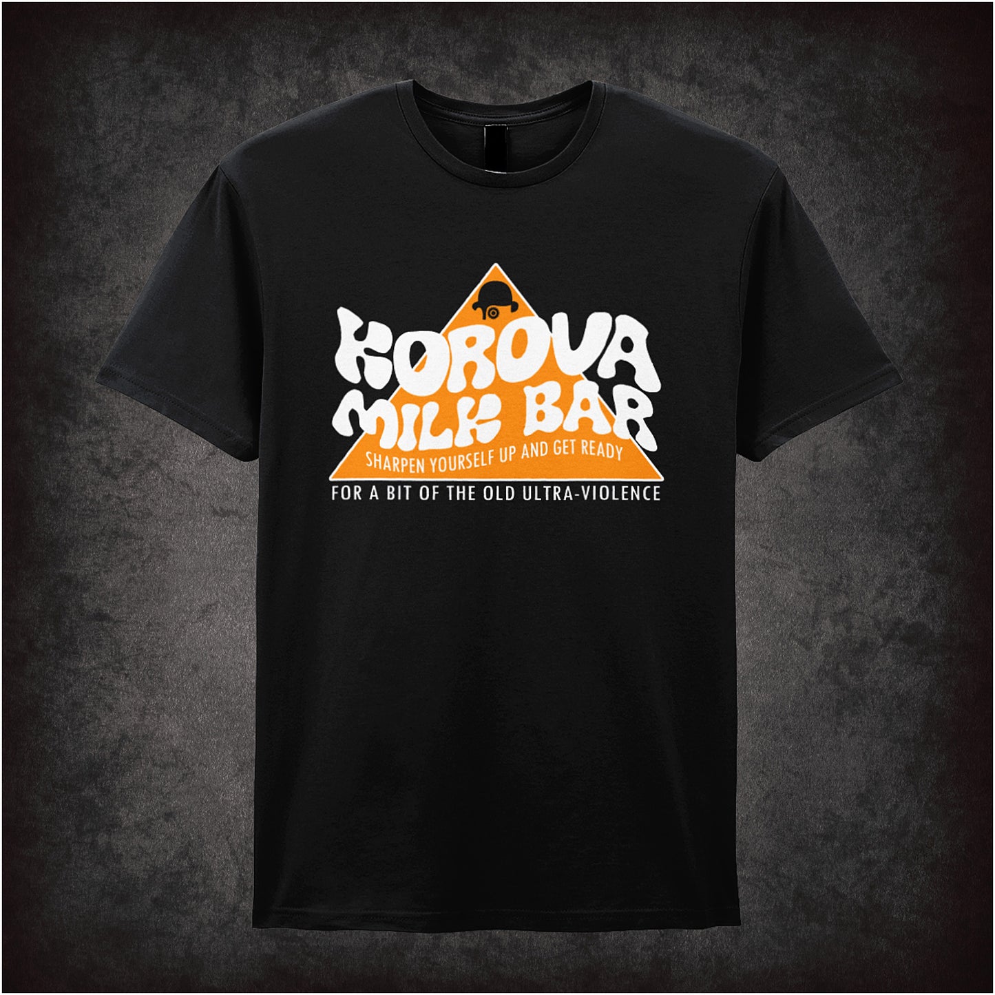 Black unisex T-shirt featuring the Korova Milk Bar logo from A Clockwork Orange in a bold, stylized white and orange design.