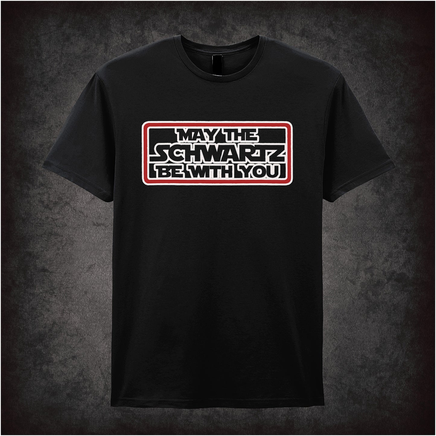 Black soft style unisex T-shirt featuring the phrase "May The Schwartz Be With You" inspired by Spaceballs, styled in bold sci-fi lettering.