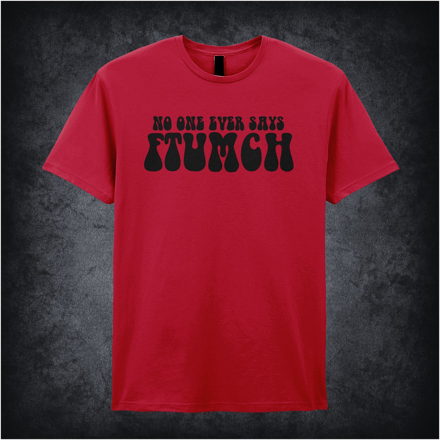 cherry red unisex t-shirt featuring the phrase “No One Ever Says Ftumch” inspired by The Young Ones TV show, with playful, bold lettering.