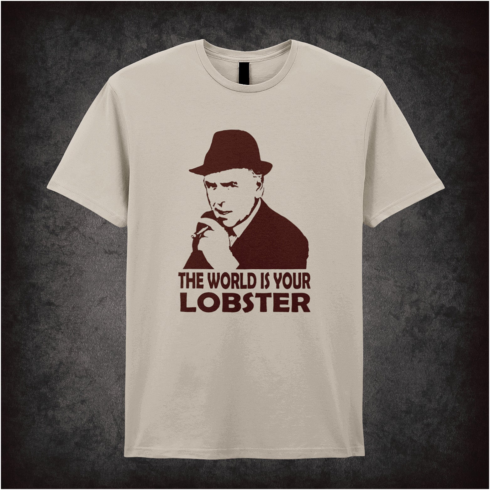 natural colour Soft style unisex T-shirt featuring the classic quote "The World Is Your Lobster" inspired by Minder, celebrating Arthur Daley’s witty charm.