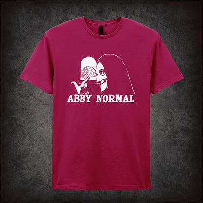 Abby Normal Young Frankenstein inspired soft style cardinal red unisex T-shirt featuring iconic movie quote design, perfect for fans of classic comedy films.