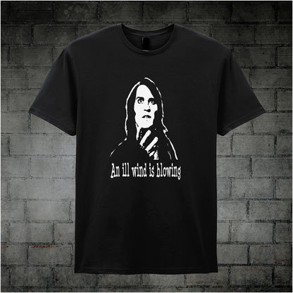 Black unisex T-shirt featuring the phrase “An Ill Wind Is Blowing” inspired by The IT Crowd, displayed in bold white text with a dramatic, minimalist design.
