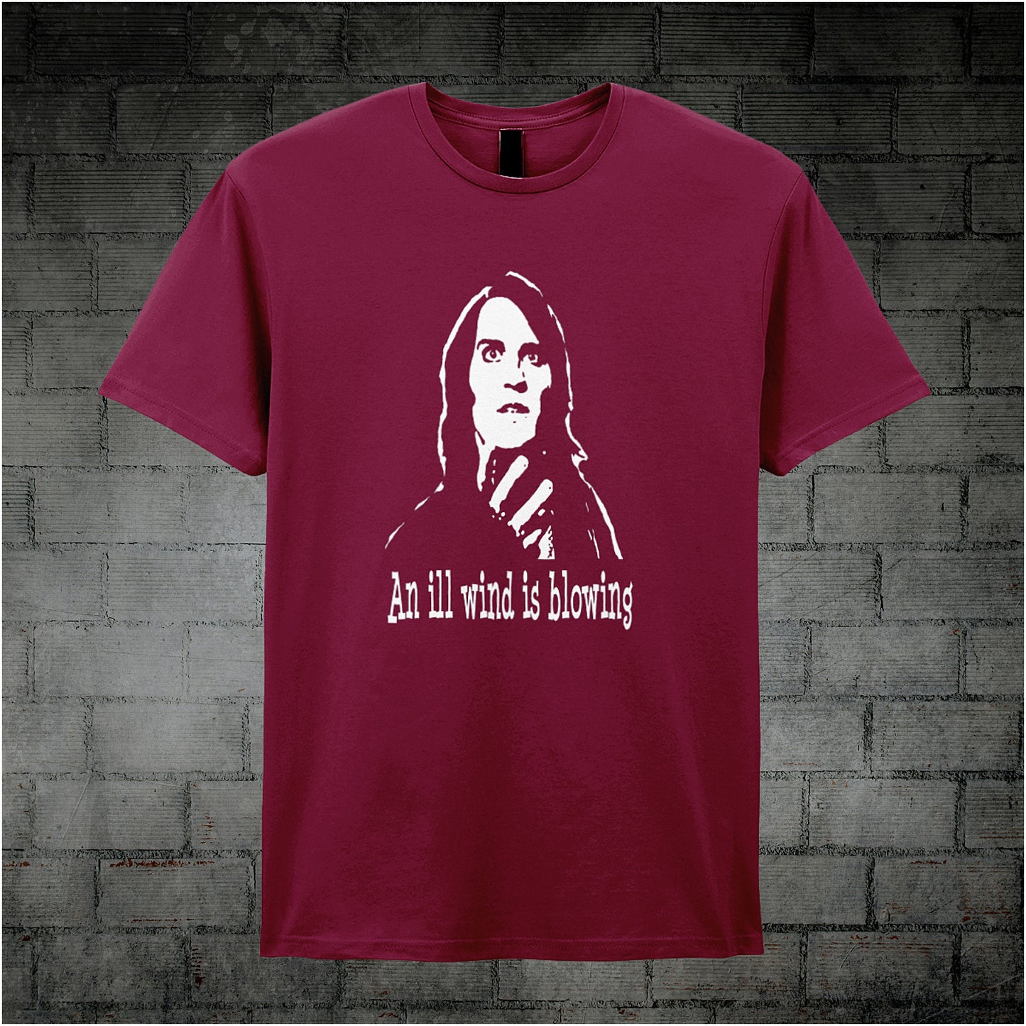 cardinal red unisex T-shirt featuring the phrase “An Ill Wind Is Blowing” inspired by The IT Crowd, displayed in bold white text with a dramatic, minimalist design.