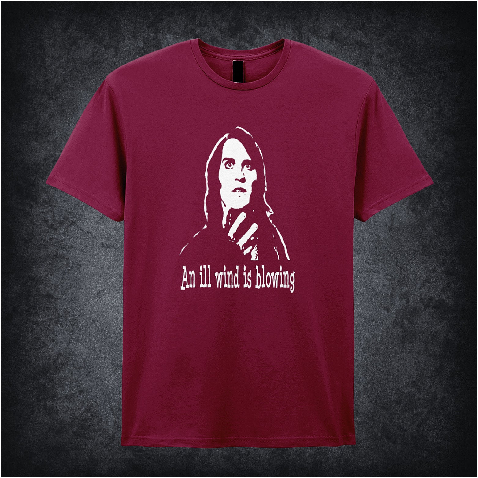 cardinal red unisex T-shirt featuring the phrase “An Ill Wind Is Blowing” inspired by The IT Crowd, displayed in bold white text with a dramatic, minimalist design.