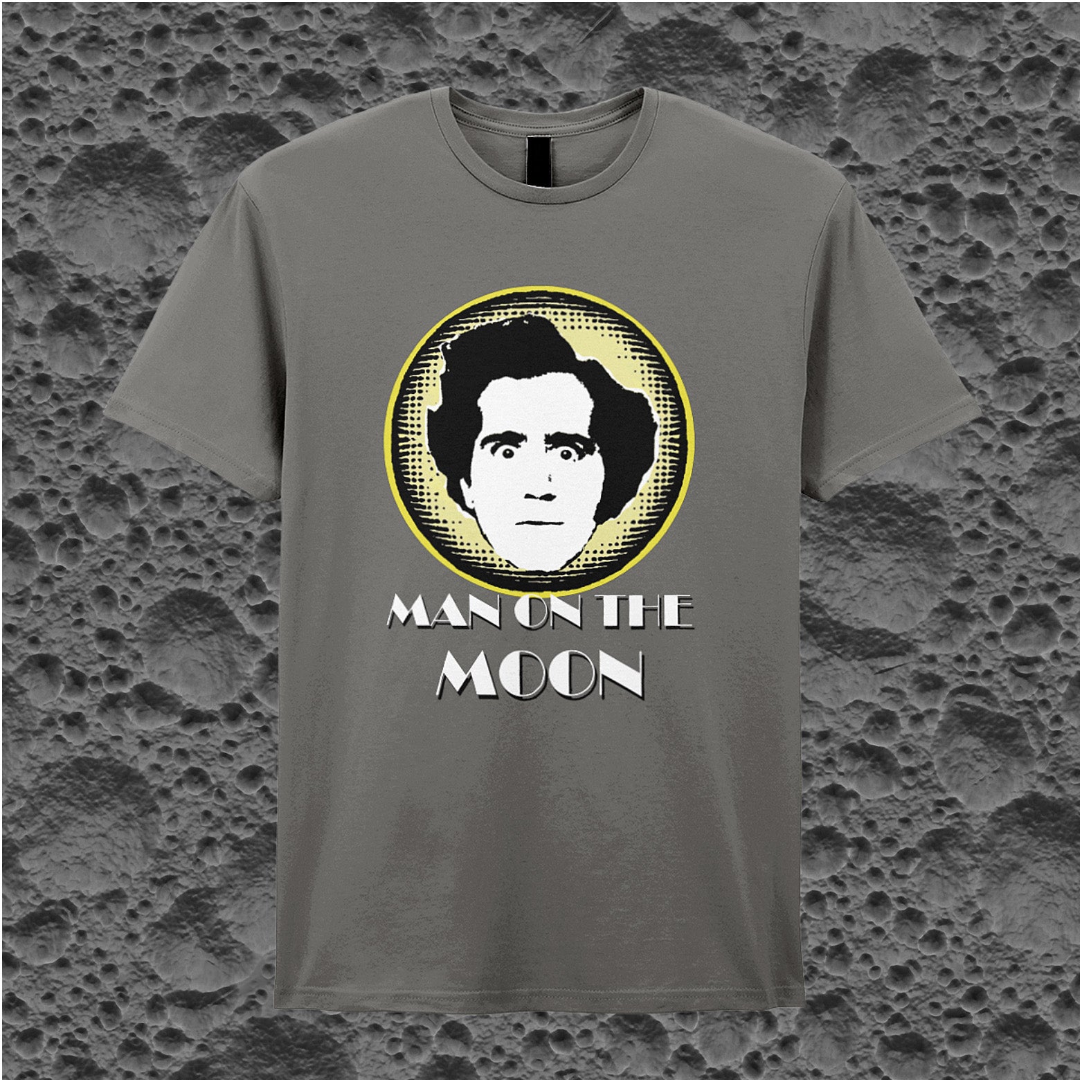 charcoal unisex T-shirt featuring “Andy Kaufman Man On The Moon” inspired design, with minimalist bold typography.