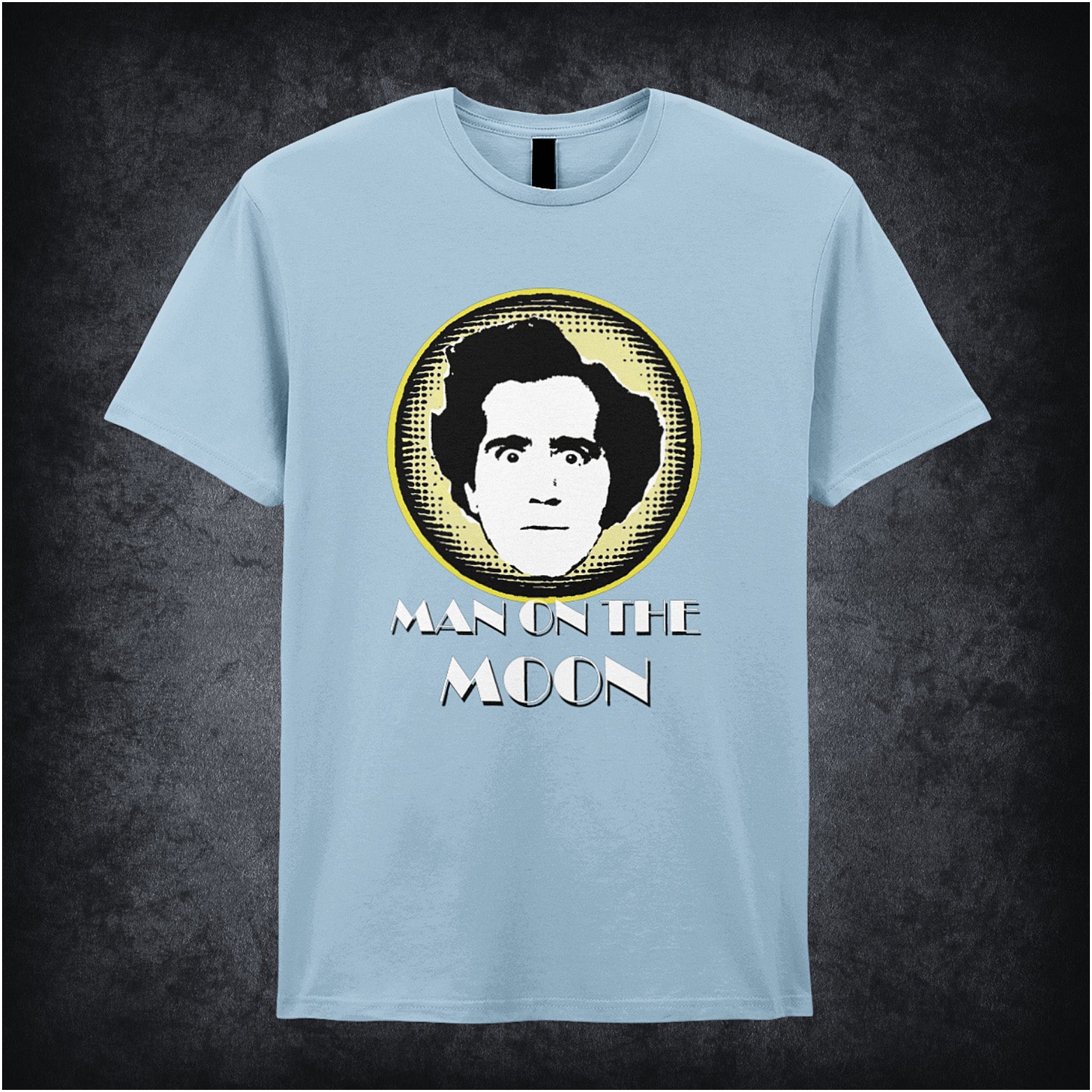 light blue unisex T-shirt featuring “Andy Kaufman Man On The Moon” inspired design, with minimalist bold typography.