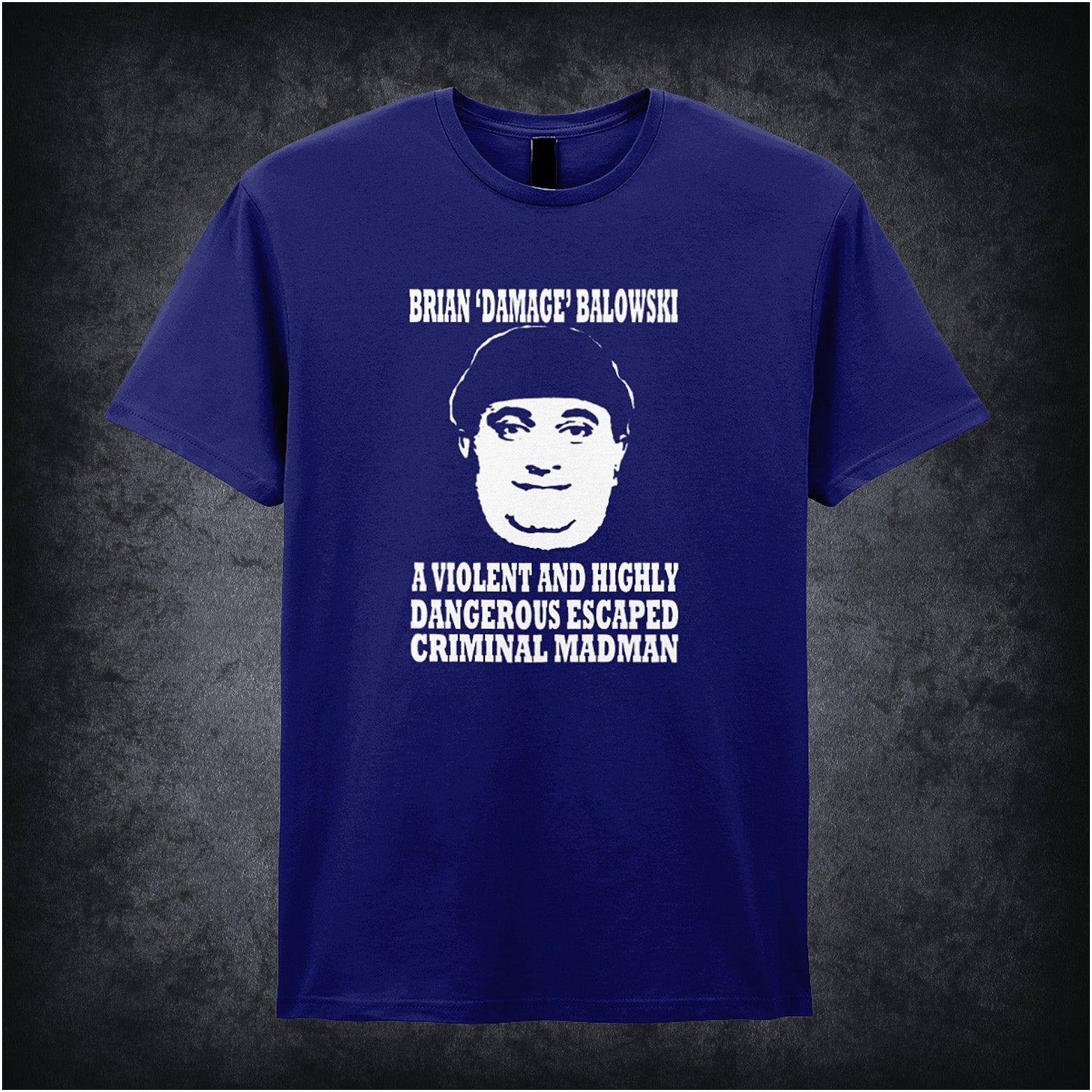 navy unisex T-shirt featuring the phrase “Brian Damage Balowski: A Violent And Highly Dangerous Escaped Criminal Madman” inspired by The Young Ones, displayed in bold white text with a chaotic, anarchic style.