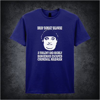 navy unisex T-shirt featuring the phrase “Brian Damage Balowski: A Violent And Highly Dangerous Escaped Criminal Madman” inspired by The Young Ones, displayed in bold white text with a chaotic, anarchic style.
