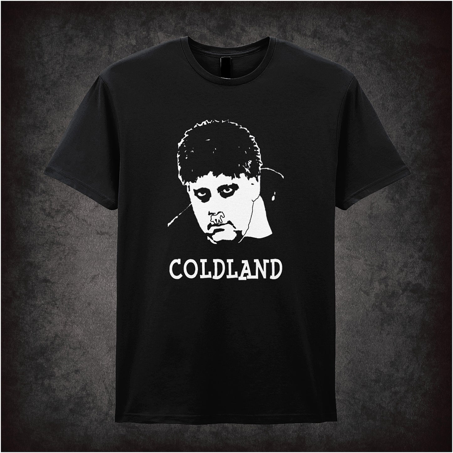 Black soft style unisex T-shirt featuring the text "Coldland" inspired by Vic and Bob, designed in a quirky, bold style reflecting their surreal comedy.