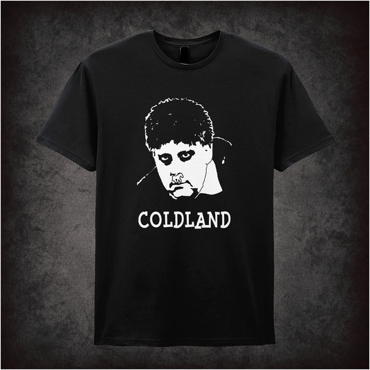Black soft style unisex T-shirt featuring the text "Coldland" inspired by Vic and Bob, designed in a quirky, bold style reflecting their surreal comedy.