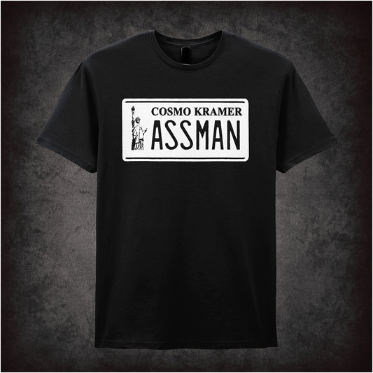 black unisex T-shirt featuring “Cosmo Kramer Assman” phrase inspired by Seinfeld, displayed in bold, playful typography.