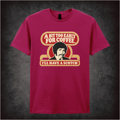 “Jason King ‘A bit too early for coffee… I’ll have a scotch’ T-shirt in cardinal red from Department S (Jason King)”