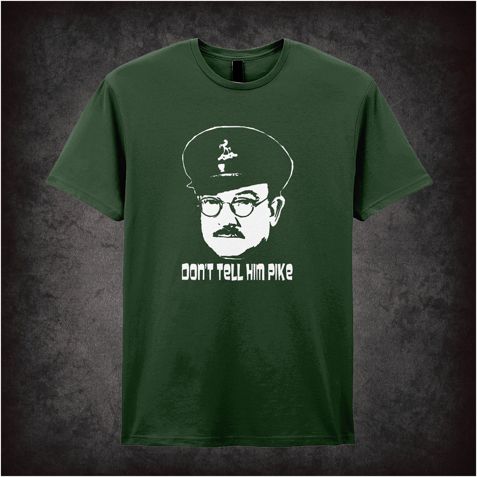 forest Soft style unisex T-shirt featuring the phrase "Don't Tell Him Pike" inspired by Dad's Army, printed in bold, classic British comedy lettering.