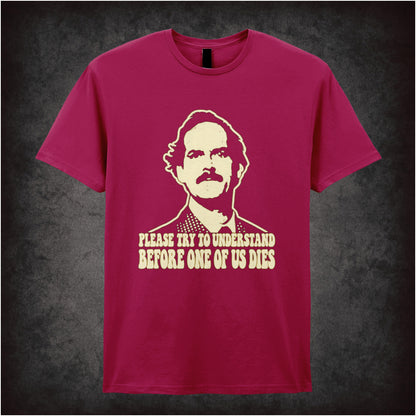 “Basil Fawlty ‘Please try to understand before one of us dies’ T-shirt in cardinal red from Fawlty Towers”