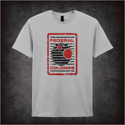 Federal Colonies – Total Recall-inspired design featuring a retro-futuristic space travel poster with bold text and planet imagery, printed on a sports grey unisex t-shirt.
