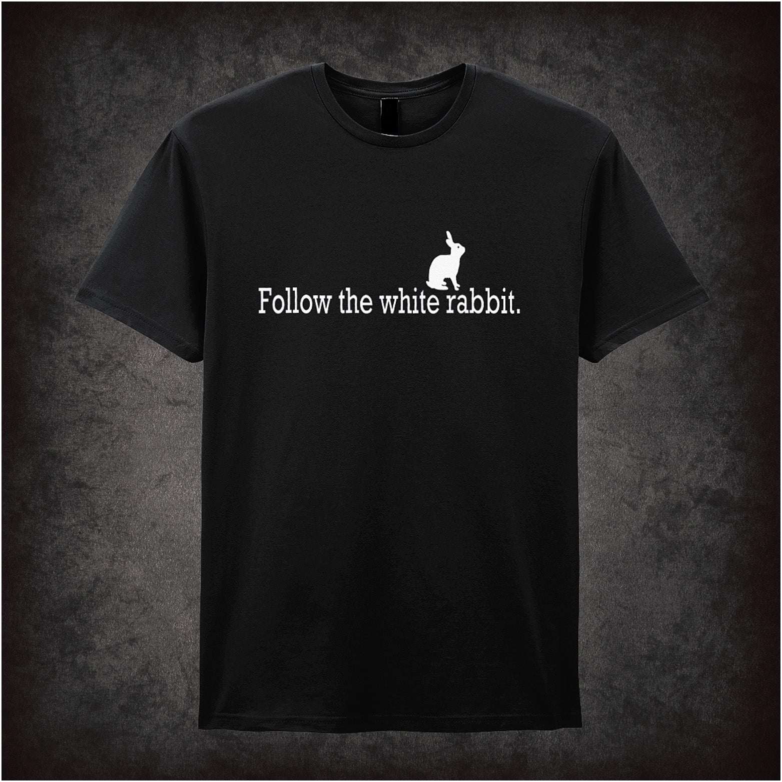Black unisex T-shirt featuring the phrase “Follow The White Rabbit” inspired by The Matrix, displayed in sleek white typography with a minimalist design.