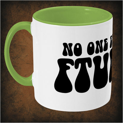 Two-tone ceramic mug featuring 'No One Ever Says Ftumch' design from The Young Ones, durable wrap-around print, left hand side dishwasher and microwave safe.