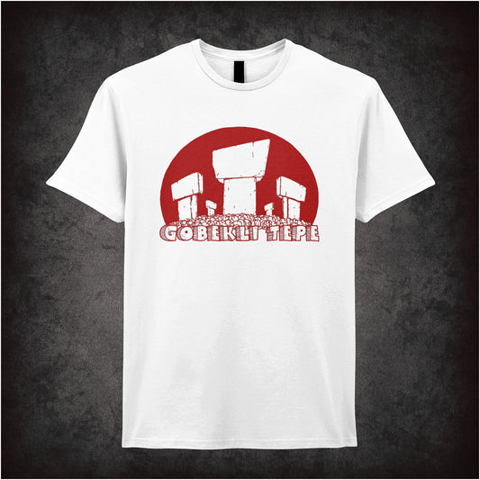 white unisex t-shirt featuring a graphic of Gobekli Tepe, the ancient Turkish archaeological site, showing stylized stone pillars with carved animal figures and geometric patterns.