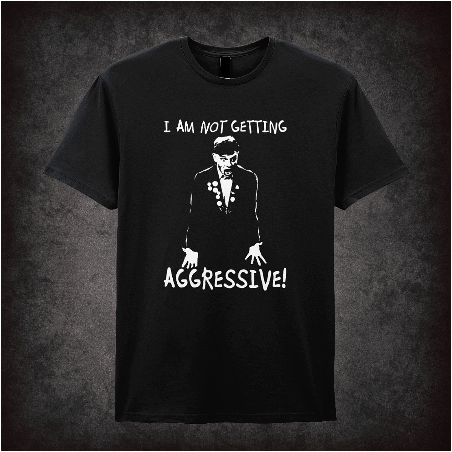 Soft style black unisex T-shirt with the phrase "I Am Not Getting Aggressive!" inspired by The Young Ones, printed in bold, rebellious comic-style lettering.