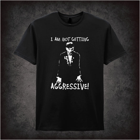 Soft style black unisex T-shirt with the phrase "I Am Not Getting Aggressive!" inspired by The Young Ones, printed in bold, rebellious comic-style lettering.