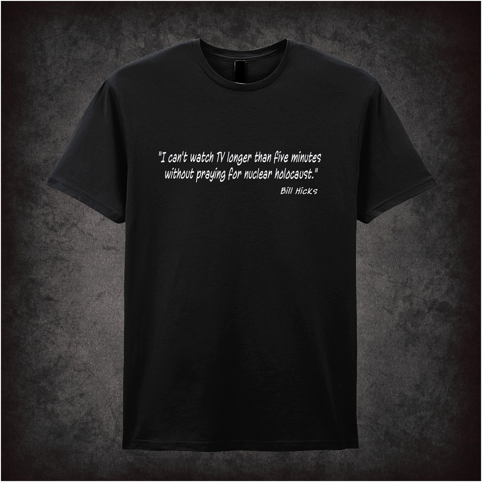 Black unisex t-shirt featuring the Bill Hicks quote "I Can't Watch TV Longer Than Five Minutes Without Praying For Nuclear Holocaust" in bold, white lettering.