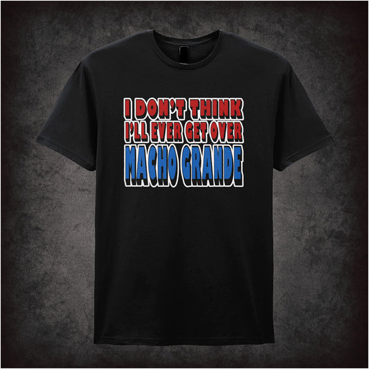 black unisex T-shirt featuring the quote “I Don't Think I'll Ever Get Over Macho Grande” inspired by Airplane!, displayed in bold, vintage-style typography.