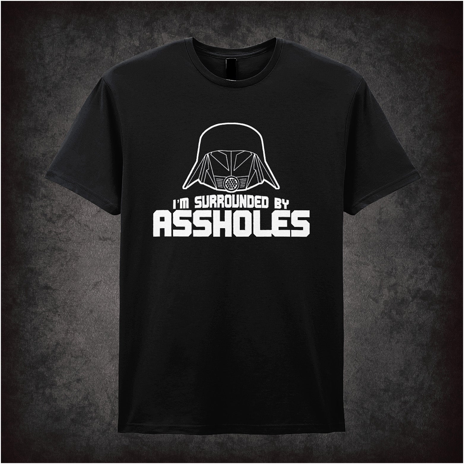 black unisex t-shirt featuring the phrase “I’m Surrounded By Assholes” in bold, humorous typography inspired by the movie Spaceballs.