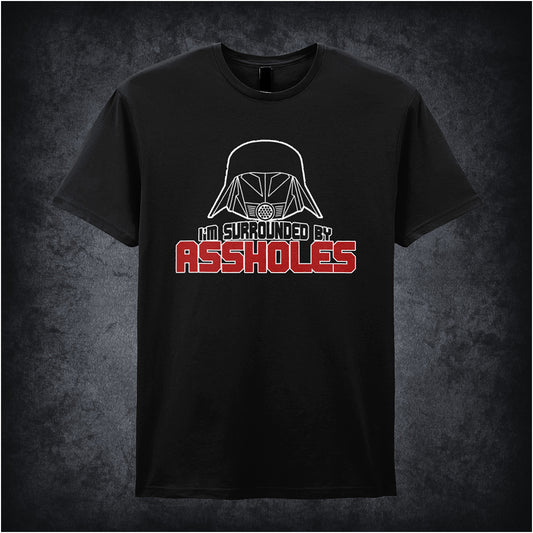 black unisex t-shirt featuring the phrase “I’m Surrounded By Assholes” in bold, humorous typography inspired by the movie Spaceballs.