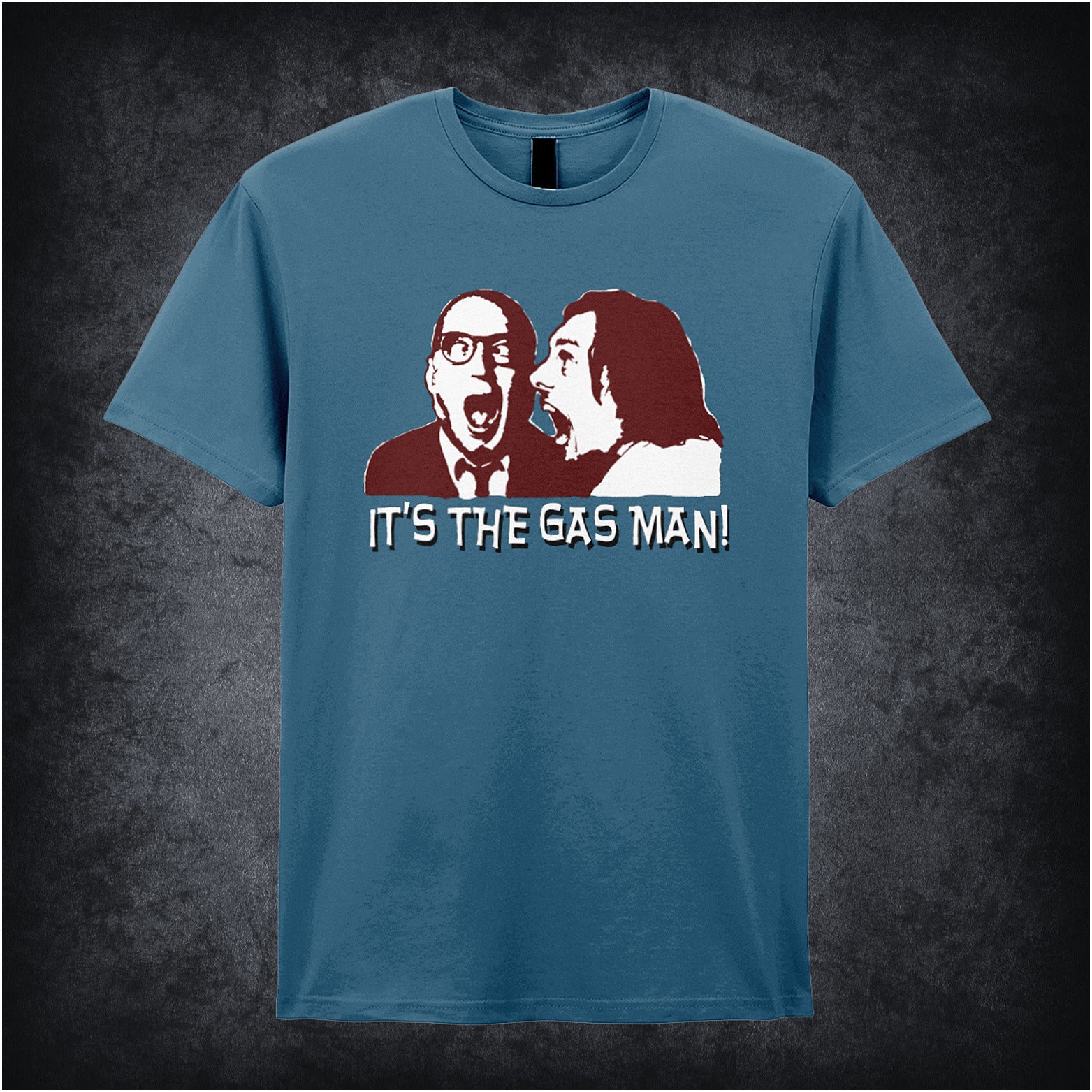 indigo unisex T-shirt featuring the phrase “It's The Gas Man!” inspired by Bottom, displayed in bold white lettering with a comedic, punchy style.