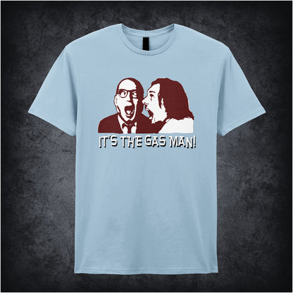 light blue unisex T-shirt featuring the phrase “It's The Gas Man!” inspired by Bottom, displayed in bold white lettering with a comedic, punchy style.