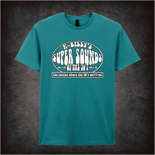 antique sapphire unisex T-shirt featuring “K-Billy's Super Sounds Of The '70s” design inspired by Reservoir Dogs, displayed in bold retro-style white lettering.