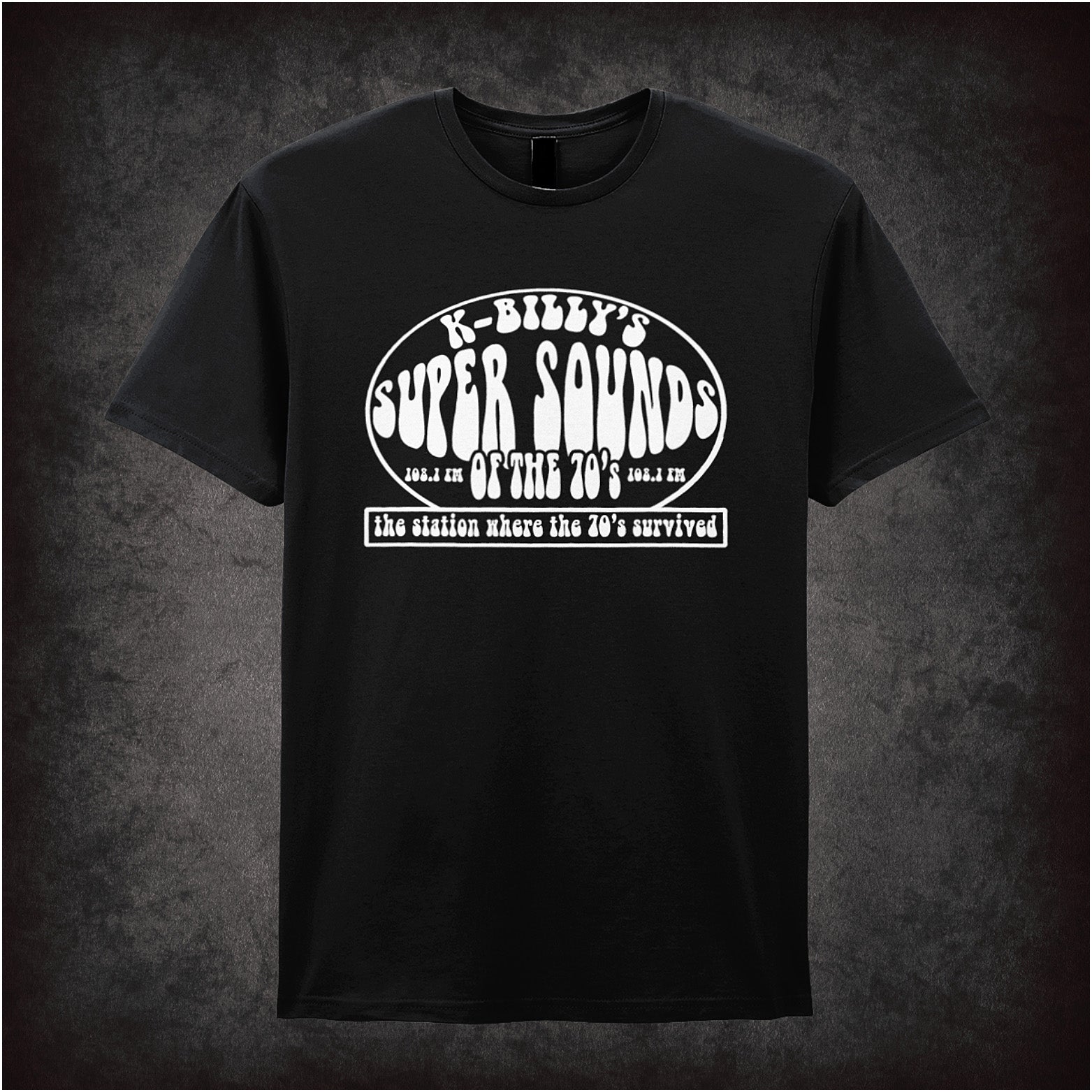 black unisex T-shirt featuring “K-Billy's Super Sounds Of The '70s” design inspired by Reservoir Dogs, displayed in bold retro-style white lettering.
