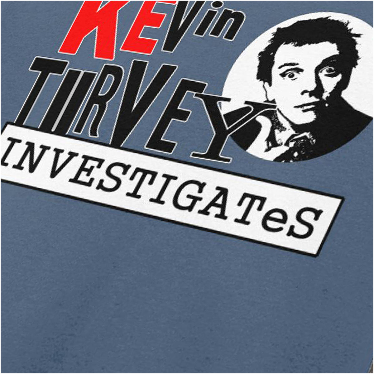 “‘Kevin Turvey Investigates’ close up T-shirt in indigo from Kevin Turvey (Rik Mayall)”