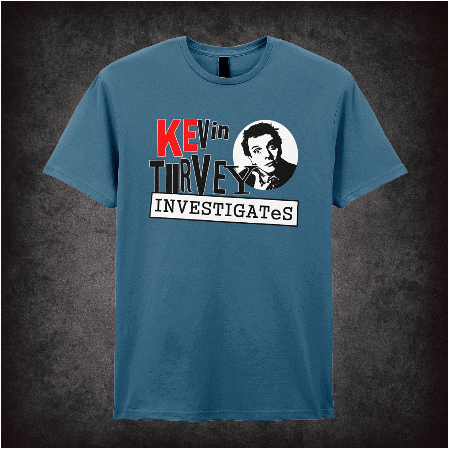 indigo unisex T-shirt featuring the word “Investigates” inspired by Kevin Turvey, with simple, bold lettering.