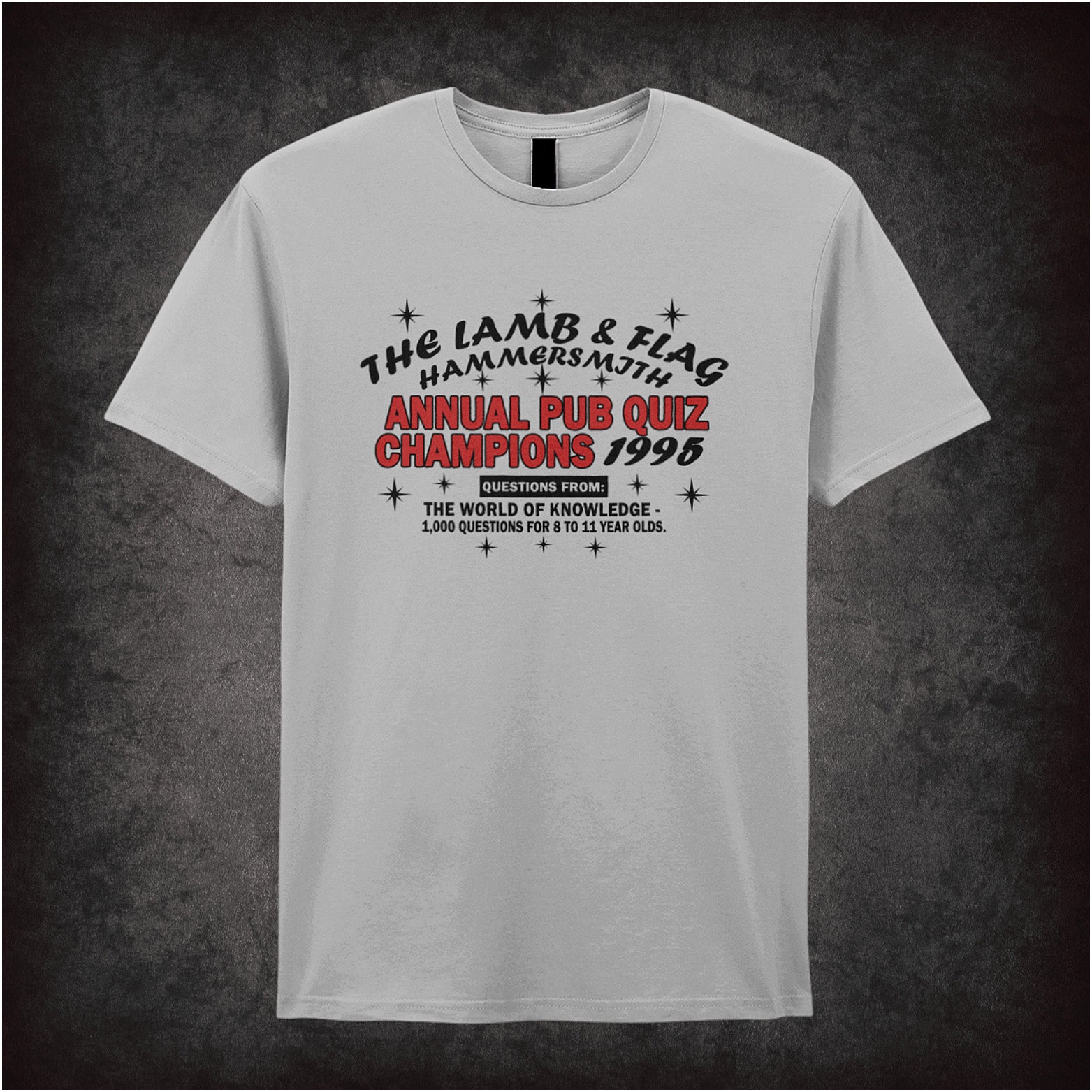 Sports grey unisex t-shirt featuring the text “The Lamb And Flag Hammersmith Annual Pub Quiz Champions 1995” inspired by the TV show Bottom, displayed in bold, vintage-style lettering.