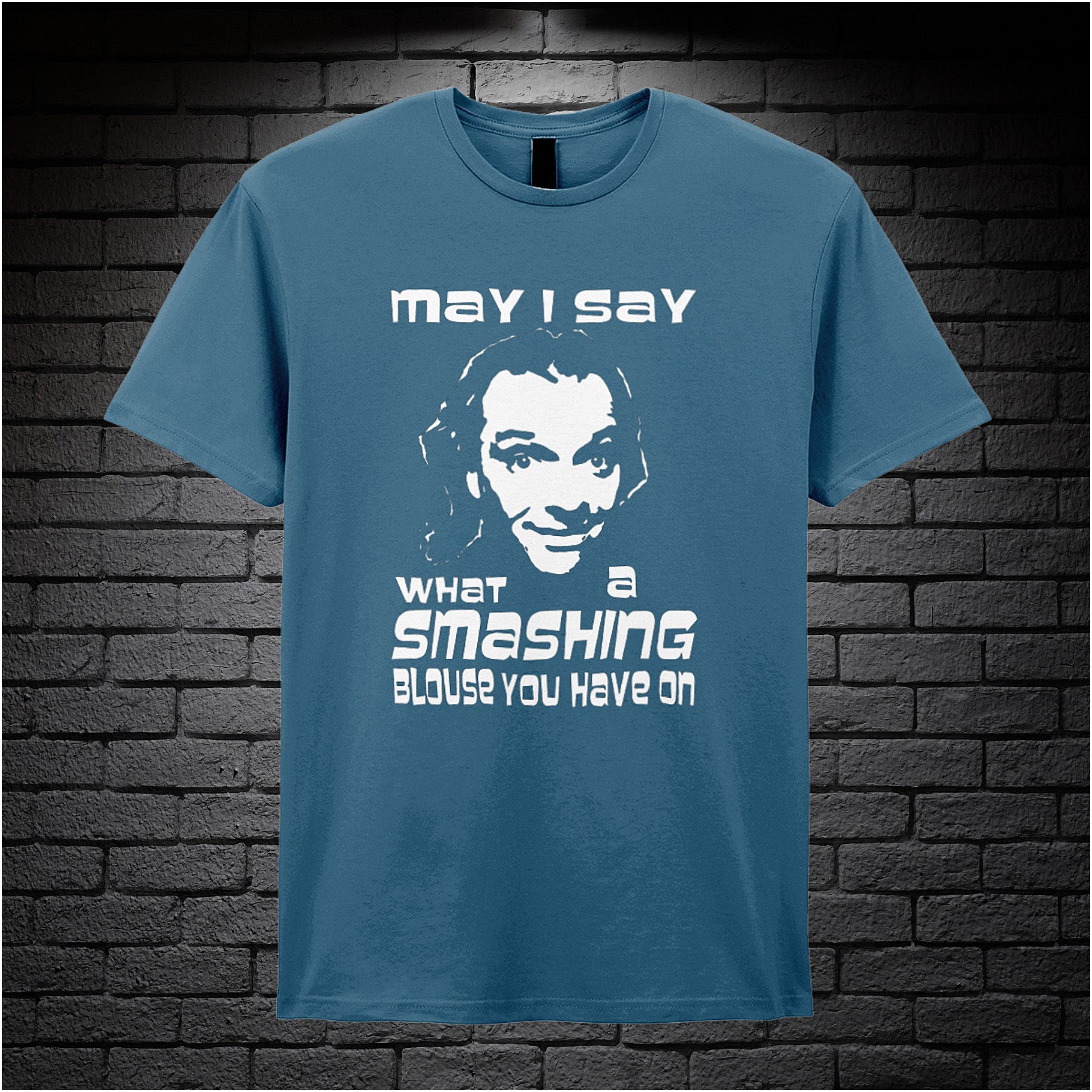 indigo unisex T-shirt featuring the phrase “May I Say What A Smashing Blouse You Have On” inspired by Bottom, displayed in bold white text with a cheeky retro vibe.