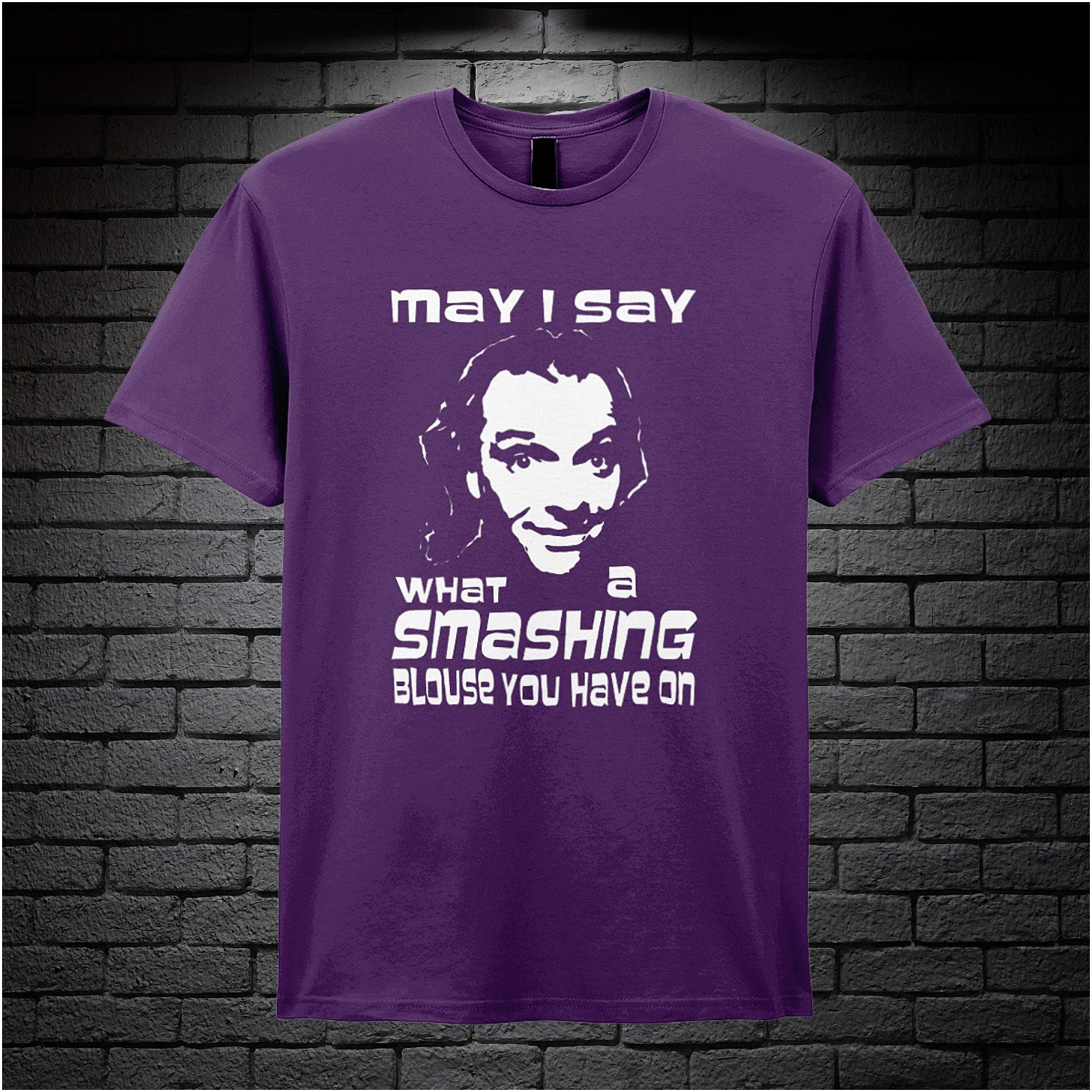 purple unisex T-shirt featuring the phrase “May I Say What A Smashing Blouse You Have On” inspired by Bottom, displayed in bold white text with a cheeky retro vibe.