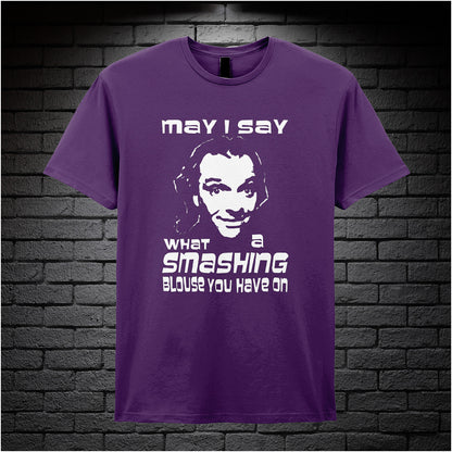 purple unisex T-shirt featuring the phrase “May I Say What A Smashing Blouse You Have On” inspired by Bottom, displayed in bold white text with a cheeky retro vibe.