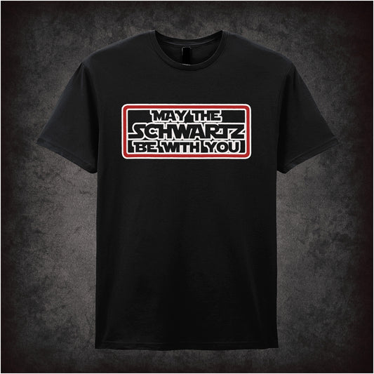 Black soft style unisex T-shirt featuring the phrase "May The Schwartz Be With You" inspired by Spaceballs, styled in bold sci-fi lettering.