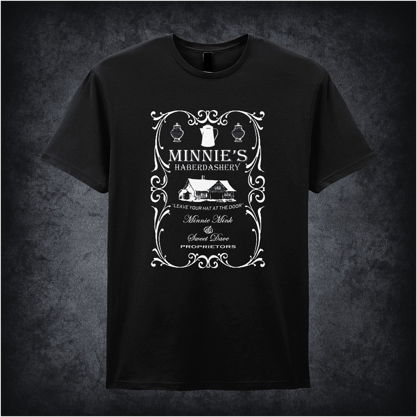 black unisex T-shirt featuring “Minnie's Haberdashery” design inspired by The Hateful Eight, with vintage-style lettering and rustic aesthetic.